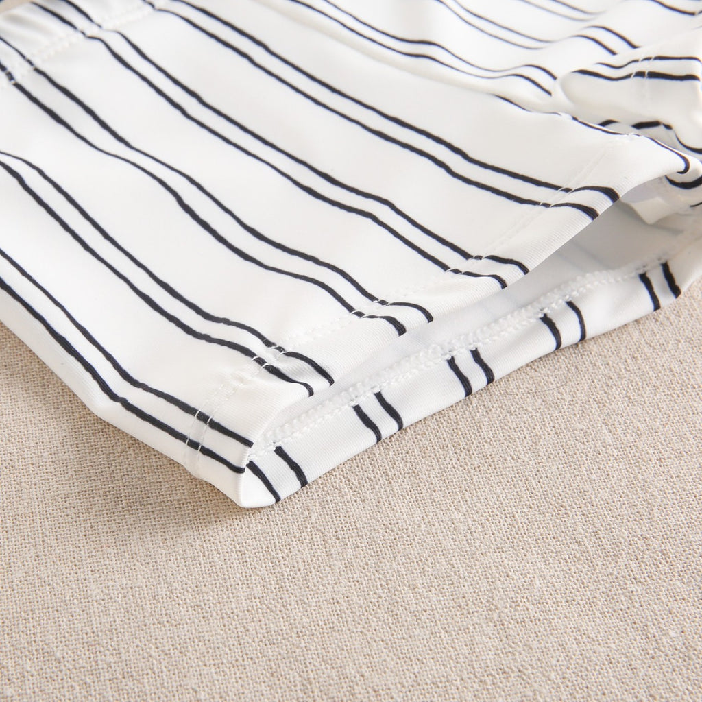 Baby boy's swimsuit in white with black stripes